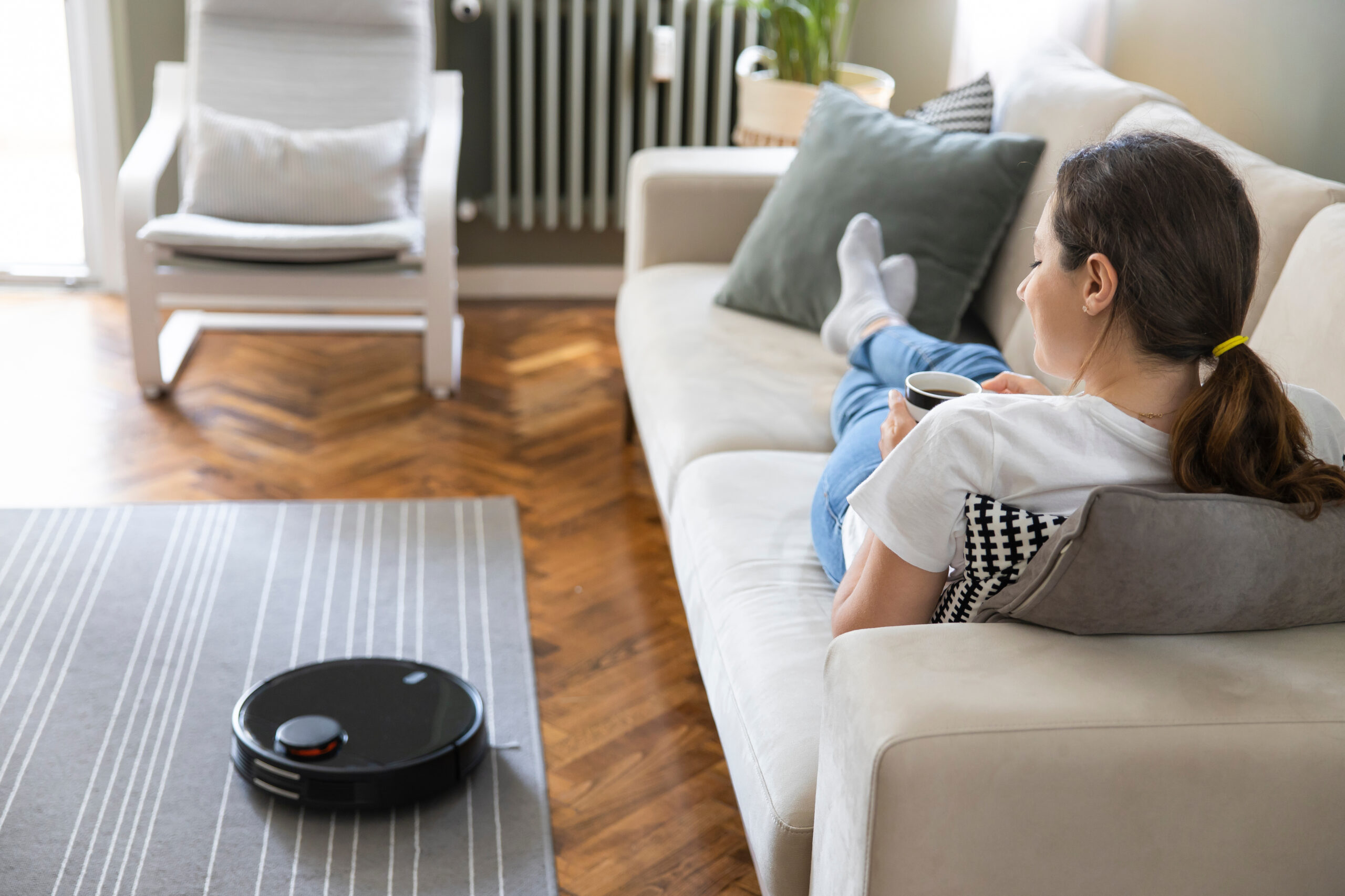 Robot vacuum cleaner cleaning the living room.